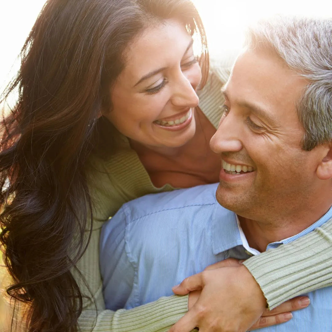 Couple embracing and smiling