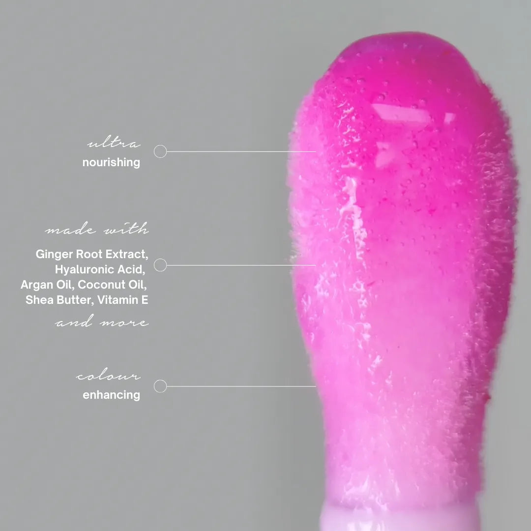 close up of lip gloss applicator with label showing colour and ingredients