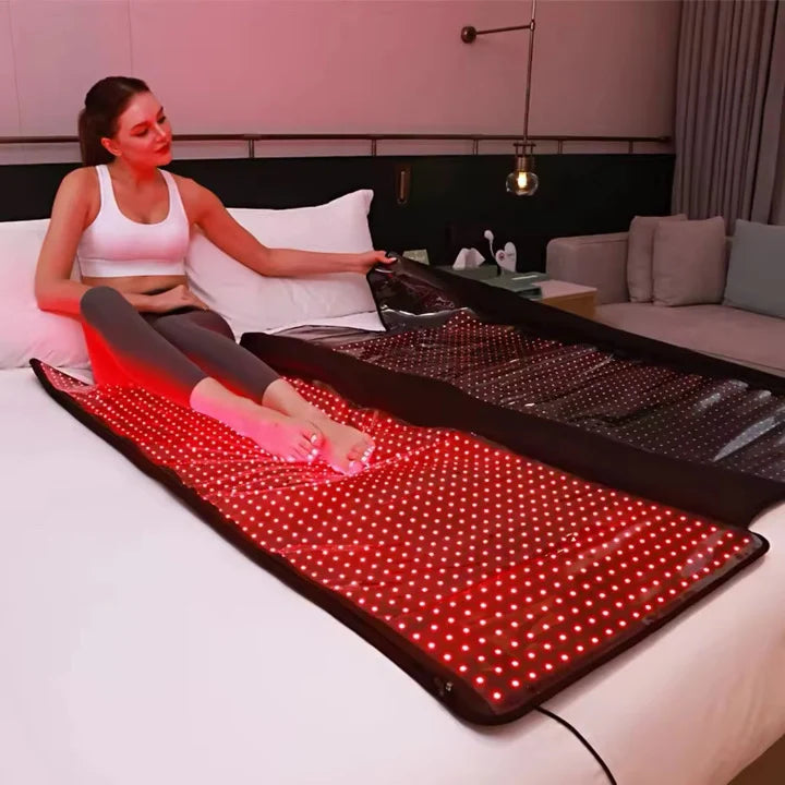 woman in red light therapy blanket