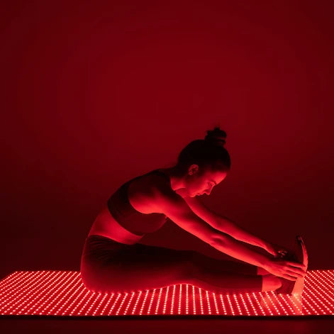 woman on red light mat