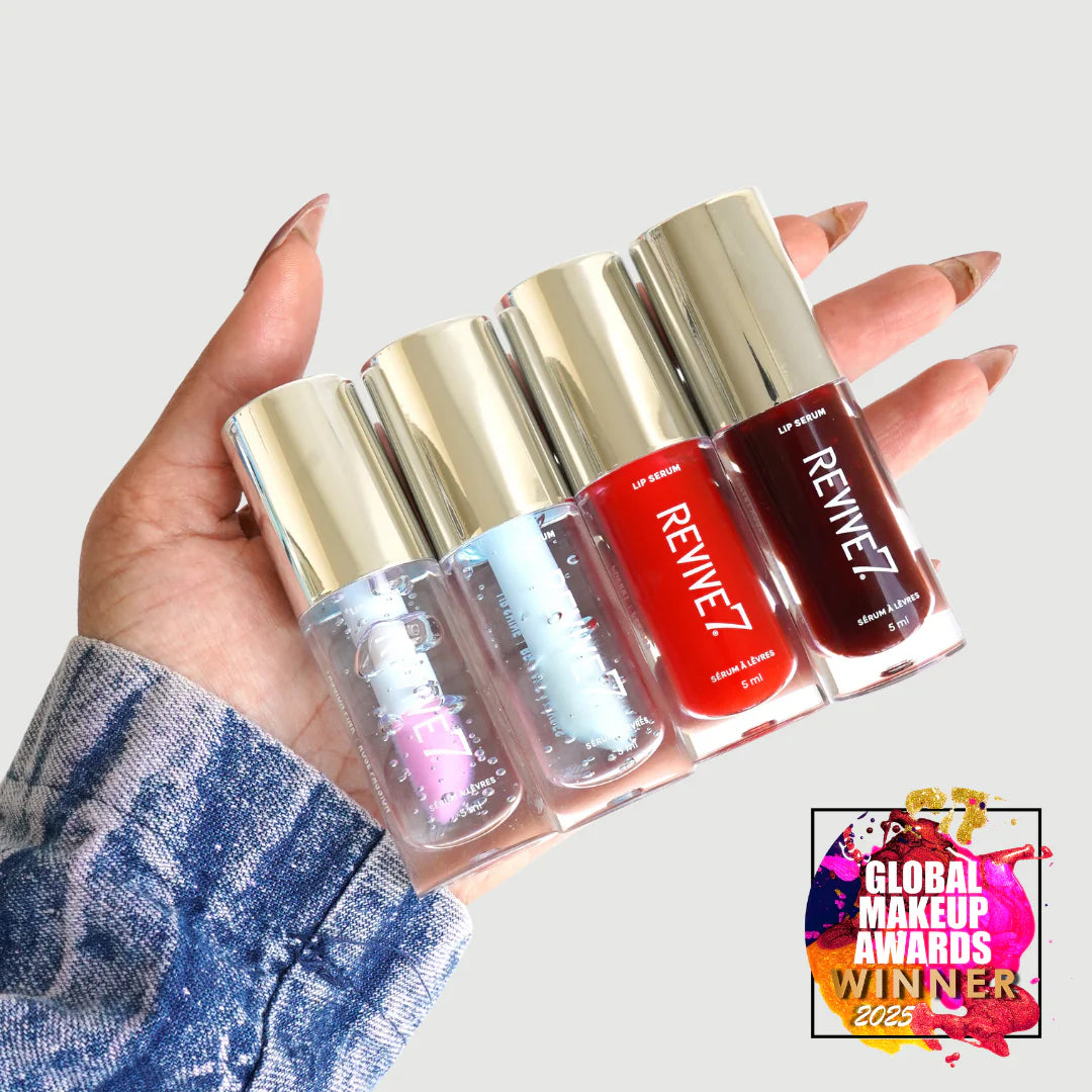 Hand holding four Revive7 lip products with a 'Global Makeup Awards Winner' badge in the corner.