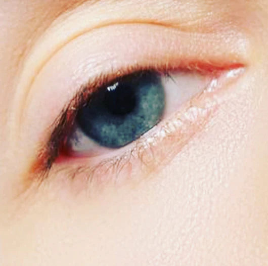 Close-up of a blue eye with visible eyelashes