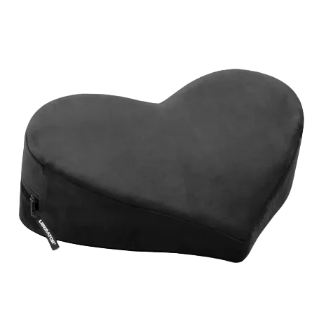 Heart-shaped black pillow on a white background