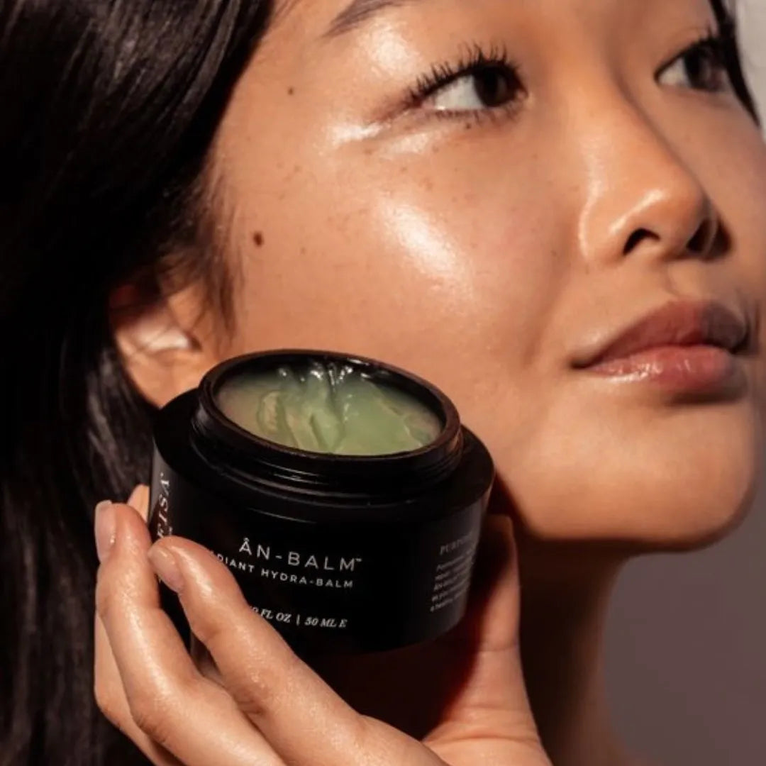 close up of woman holding ANFISA An Balm