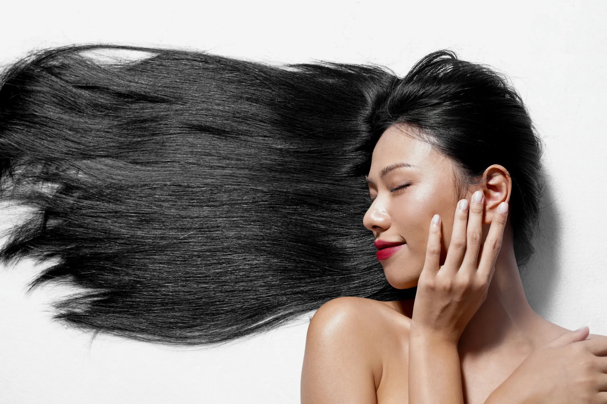 Woman with long, flowing hair representing hair health and hair growth support