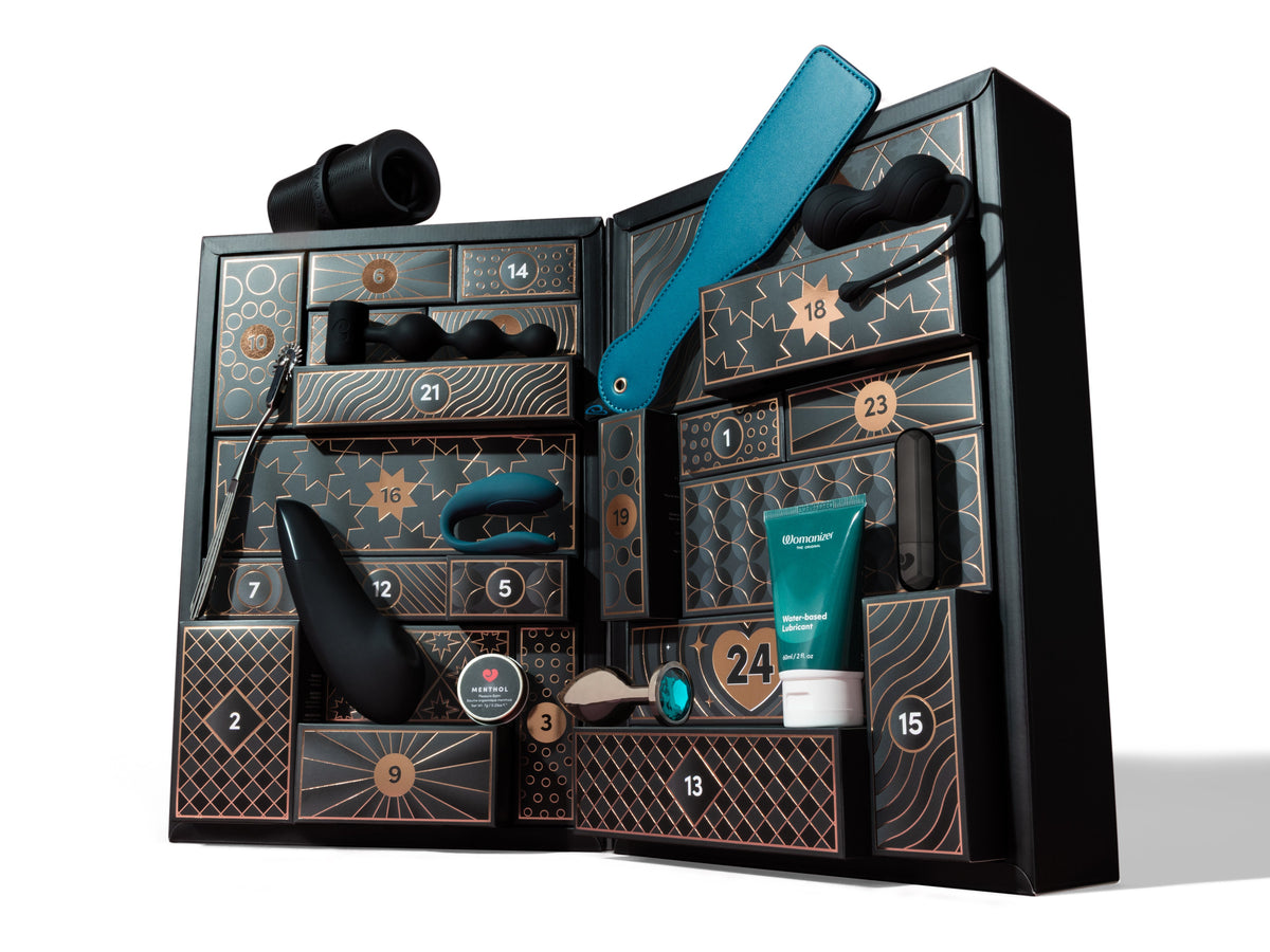 black advent calendar and random sex toys on white background