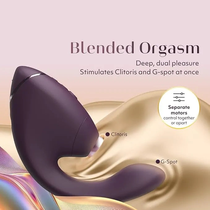 A dark purple dual-stimulation personal massager shown on a soft pink and gold background with text reading 'Blended Orgasm' and feature callouts for Clitoris and G-Spot.