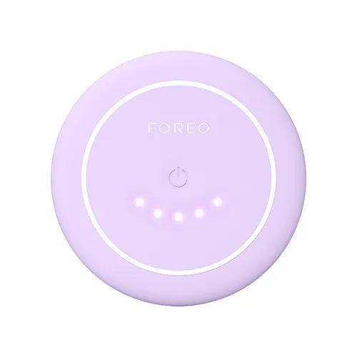 Purple FOREO device on a white background