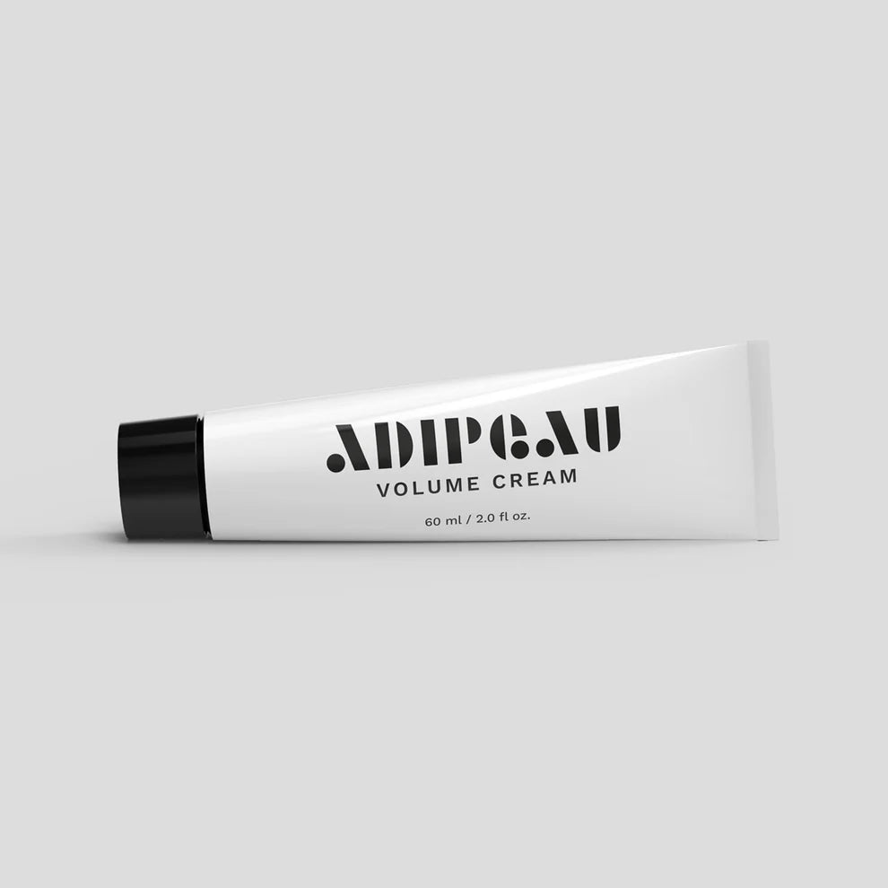 Tube of Adipocut Volume Cream on a light gray background