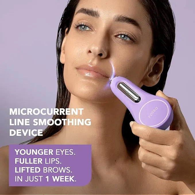 Woman holding FOREO device to side of lips