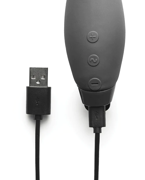 Black electronic device with USB cable on a white background