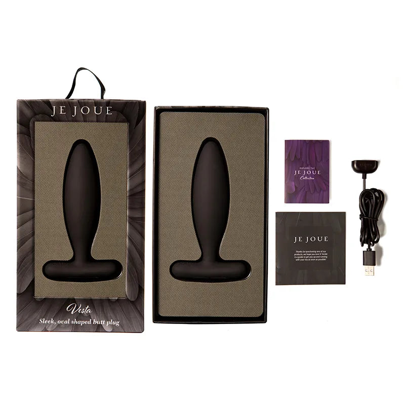 Black butt plug with packaging and accessories on a white background