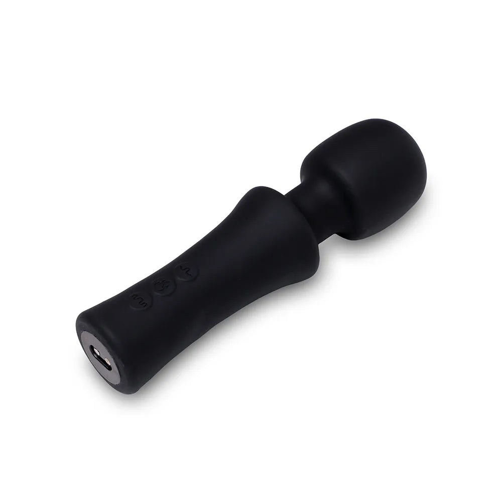 Black handheld massager on a white background