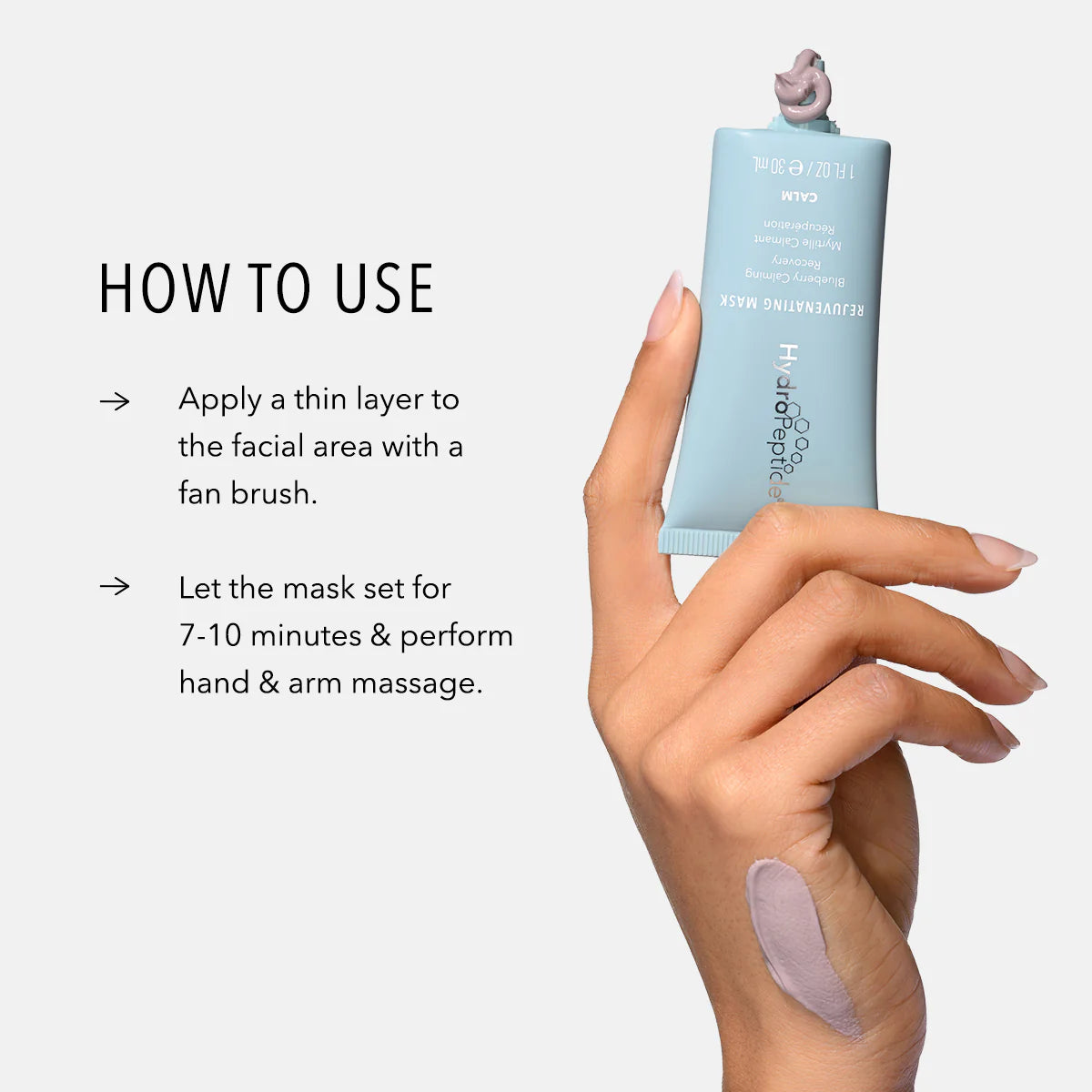 Hand holding a skincare product with application instructions on a light gray background