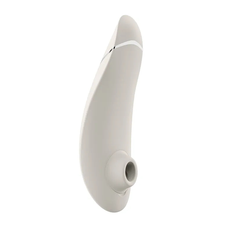 A sleek, minimalist white curved silicone device with a small circular opening at the base, shown against a solid white background.