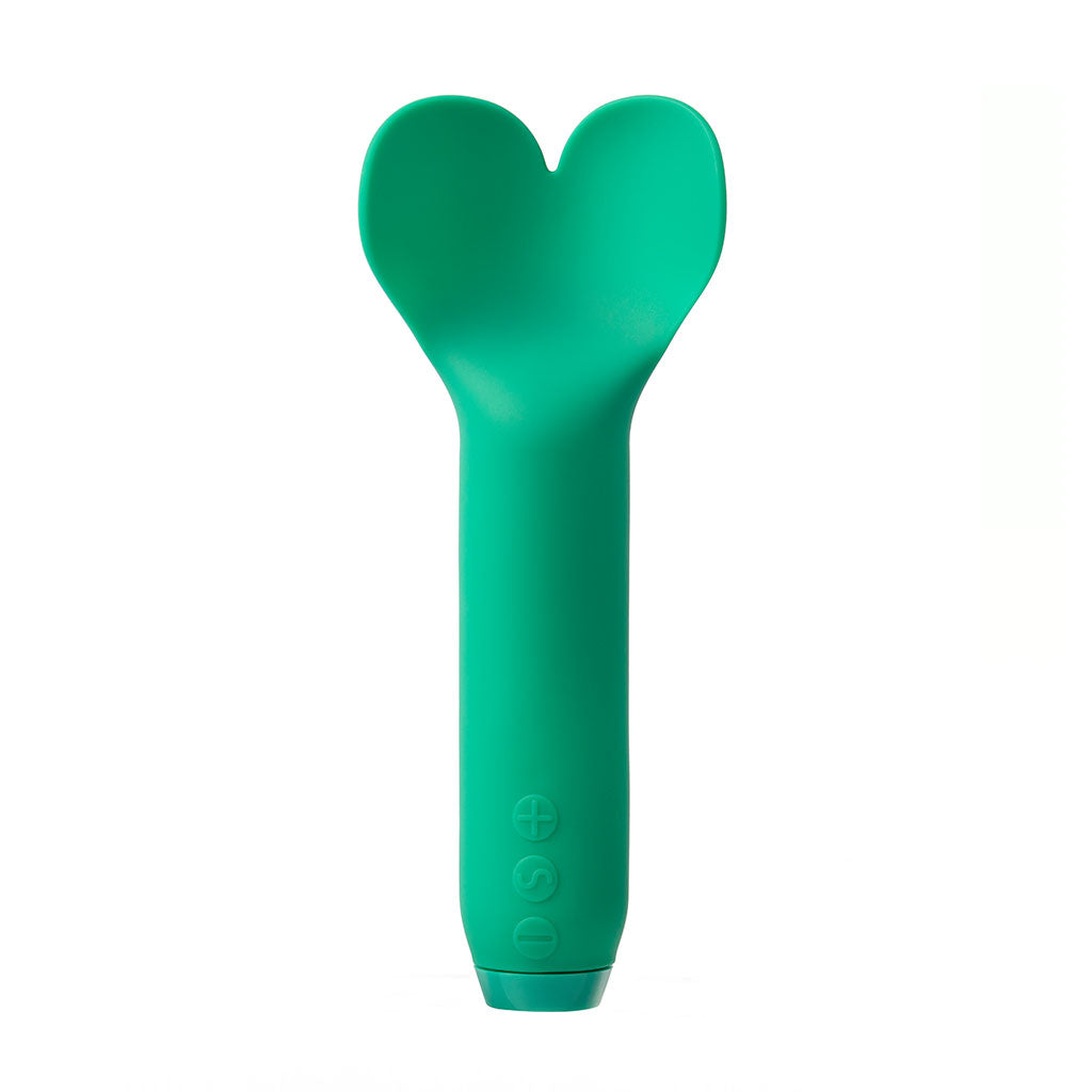 Green handheld massager on a white background