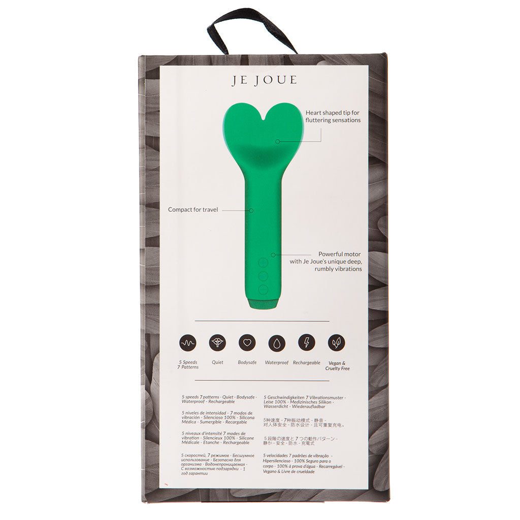 Green heart-shaped massager in packaging with 'Je Joue' branding on a white background