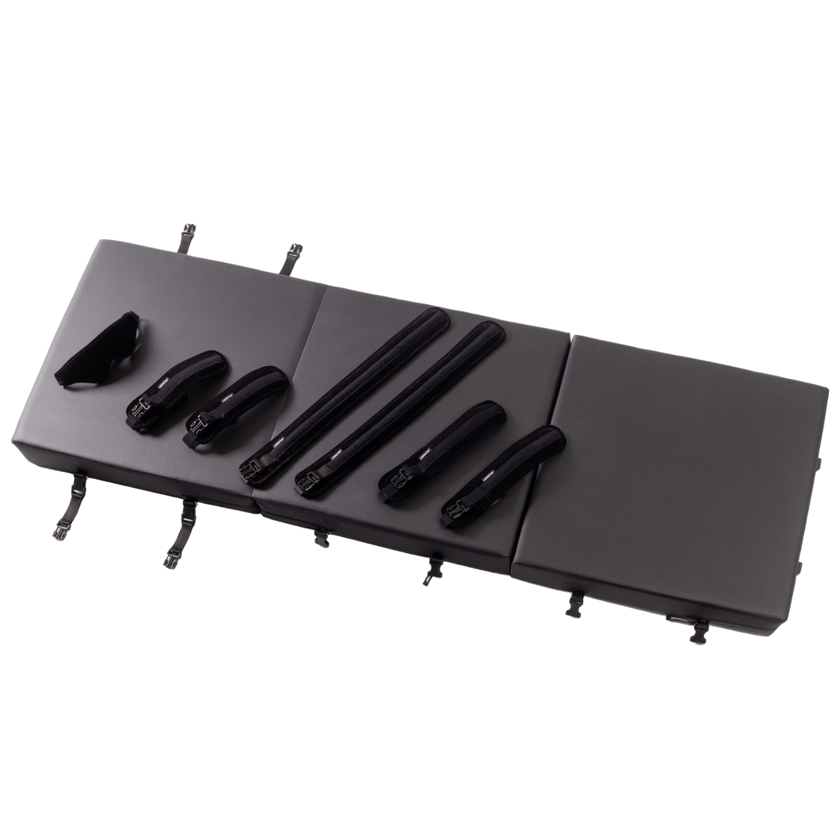 Black folding table with multiple attachments on a white background