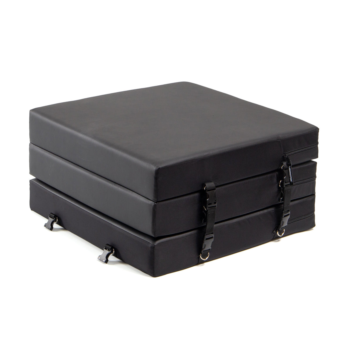 Stack of black foam mats with straps on a white background