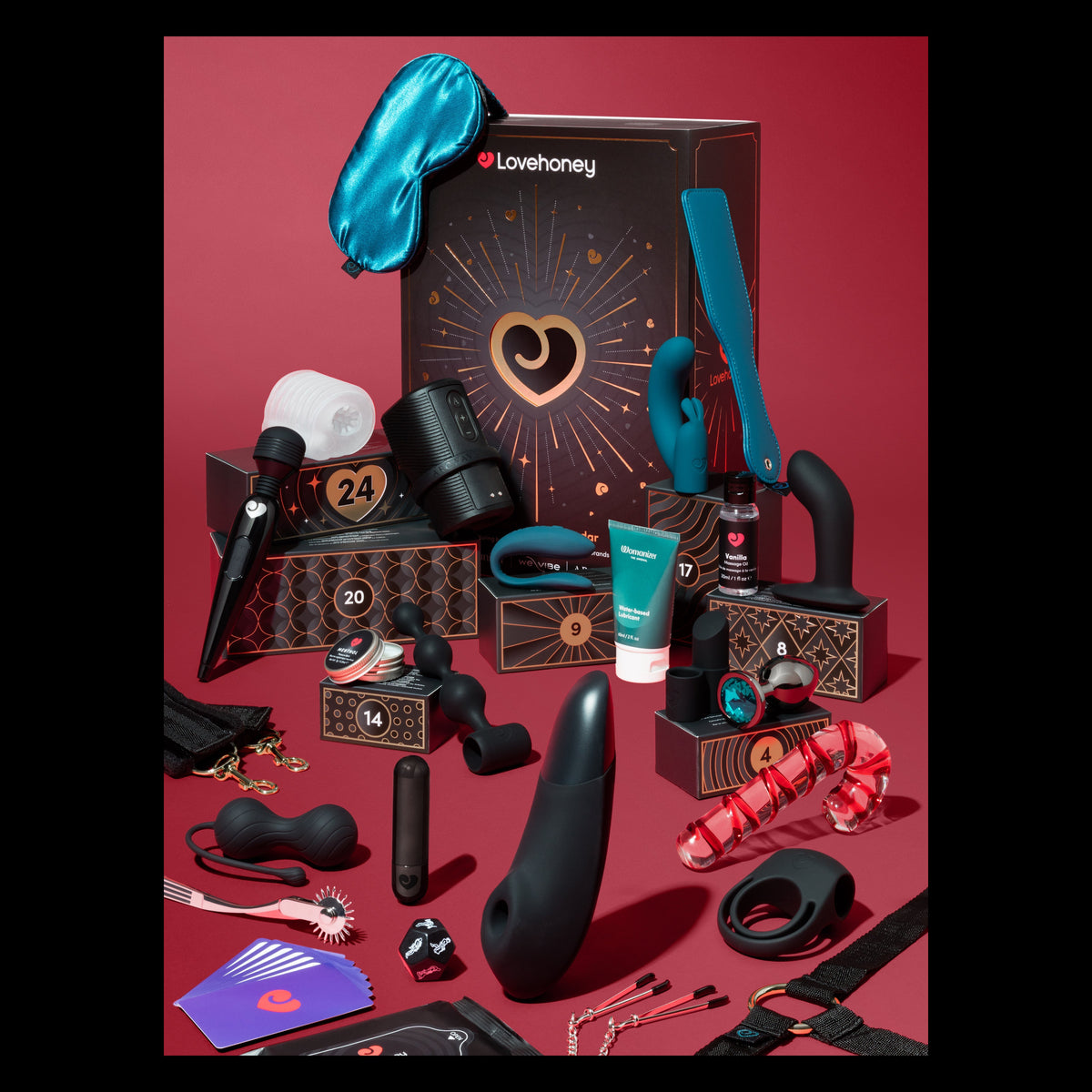 mix of sex toys and lovehoney black advent calendar on red background