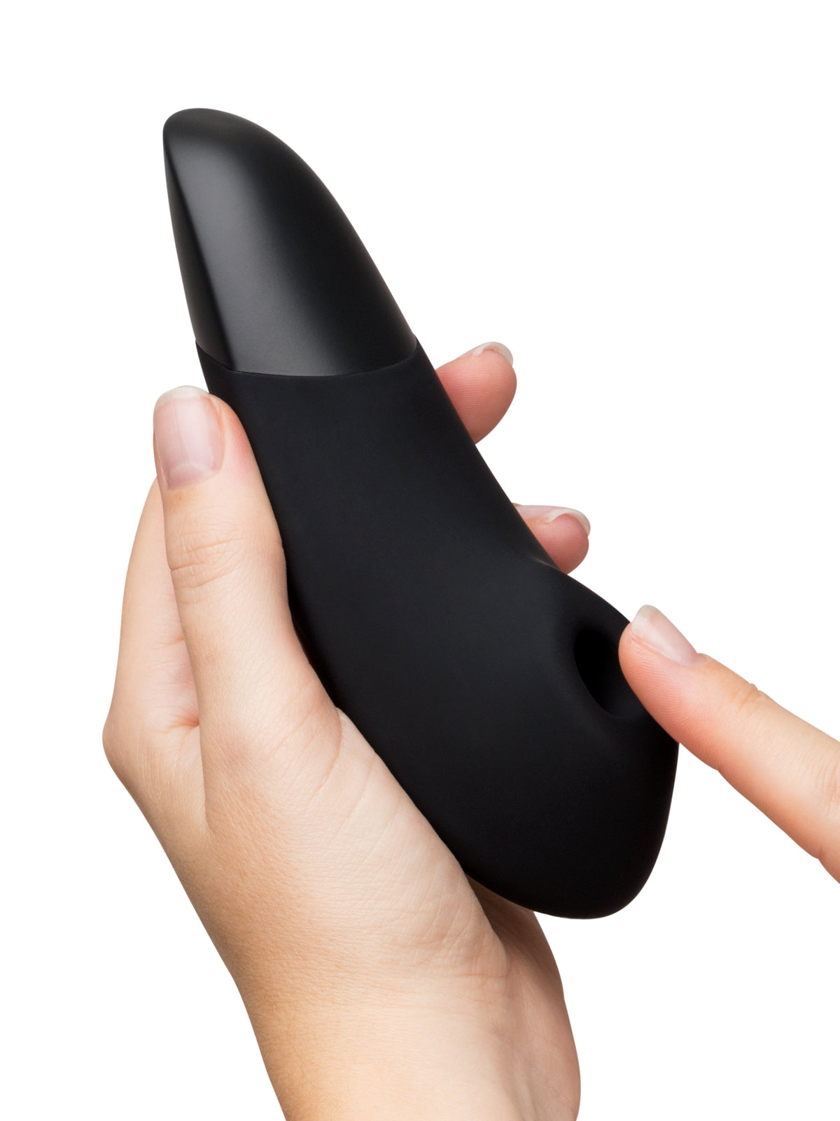 close up of hand holding black massager