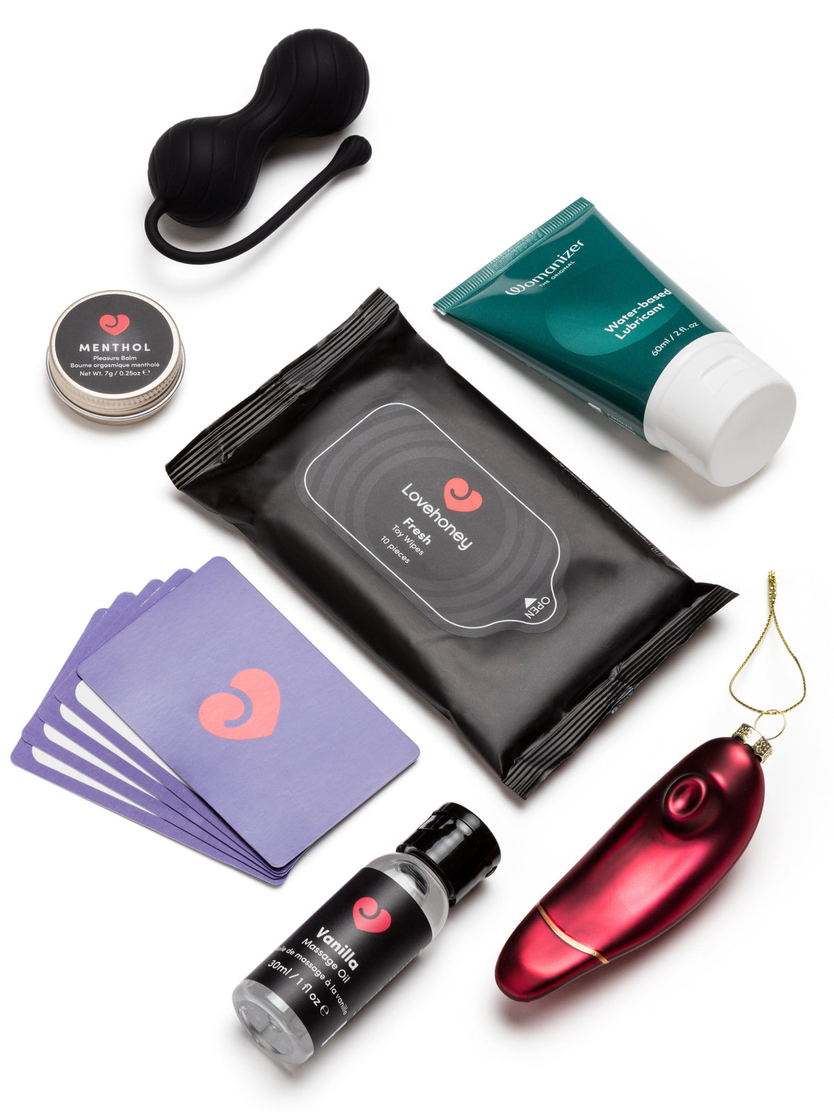 Mix of playing cards, lubricant and play accessories on white background