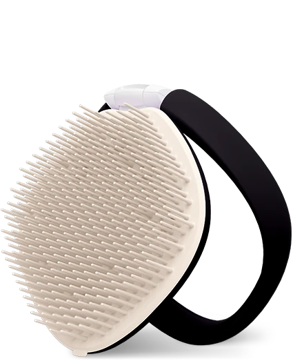 A Tangle Teezer hair detangling brush with a cream-colored silicone bristle head and a black silicone loop handle, shown on a clean white background.