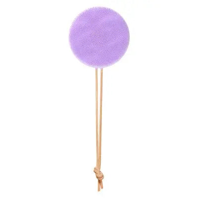 Purple body brush with a string with a knot, on a white background
