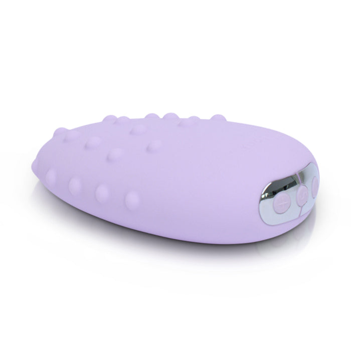 Purple silicone massager on a white background