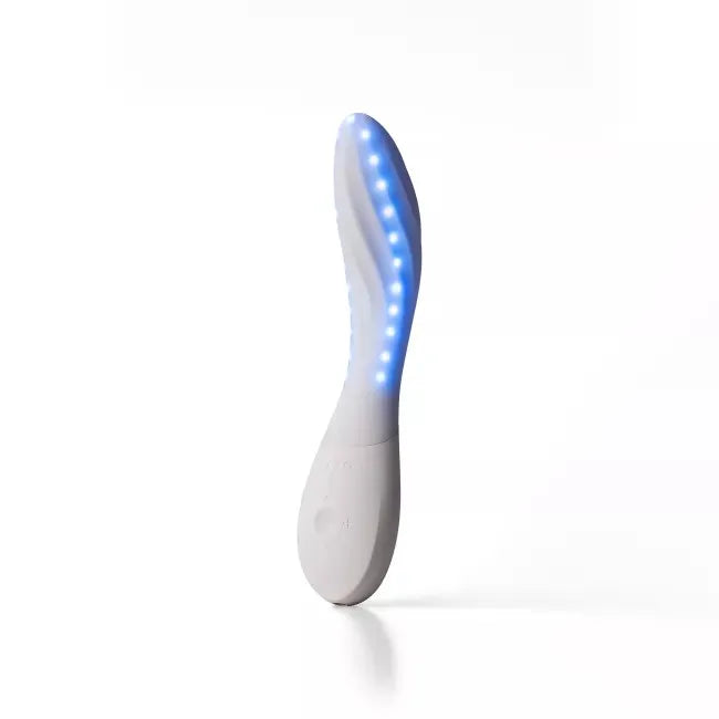 A curved personal massager with a white body and glowing blue LED light strip, standing upright on a white background.