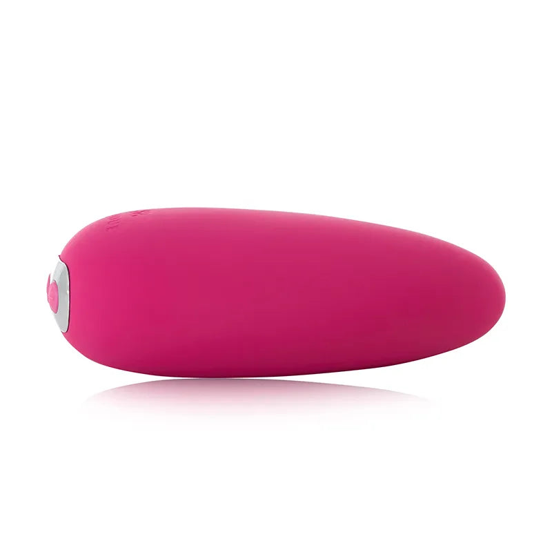 Pink handheld massager on a white background