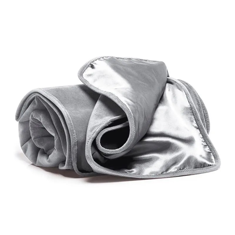 Folded gray blanket on a white background