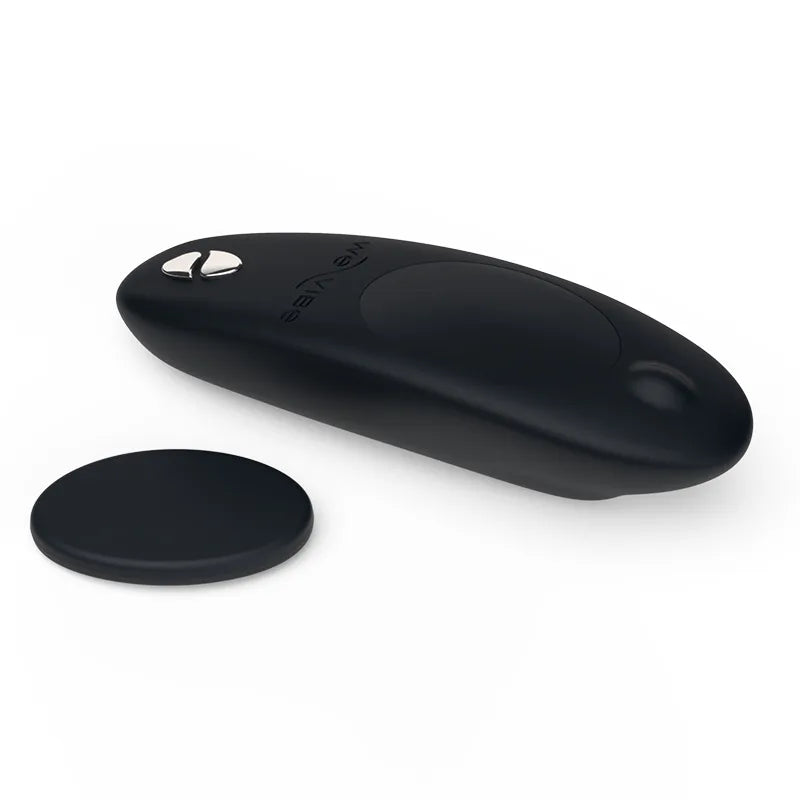 Black electronic device with a round component on a white background