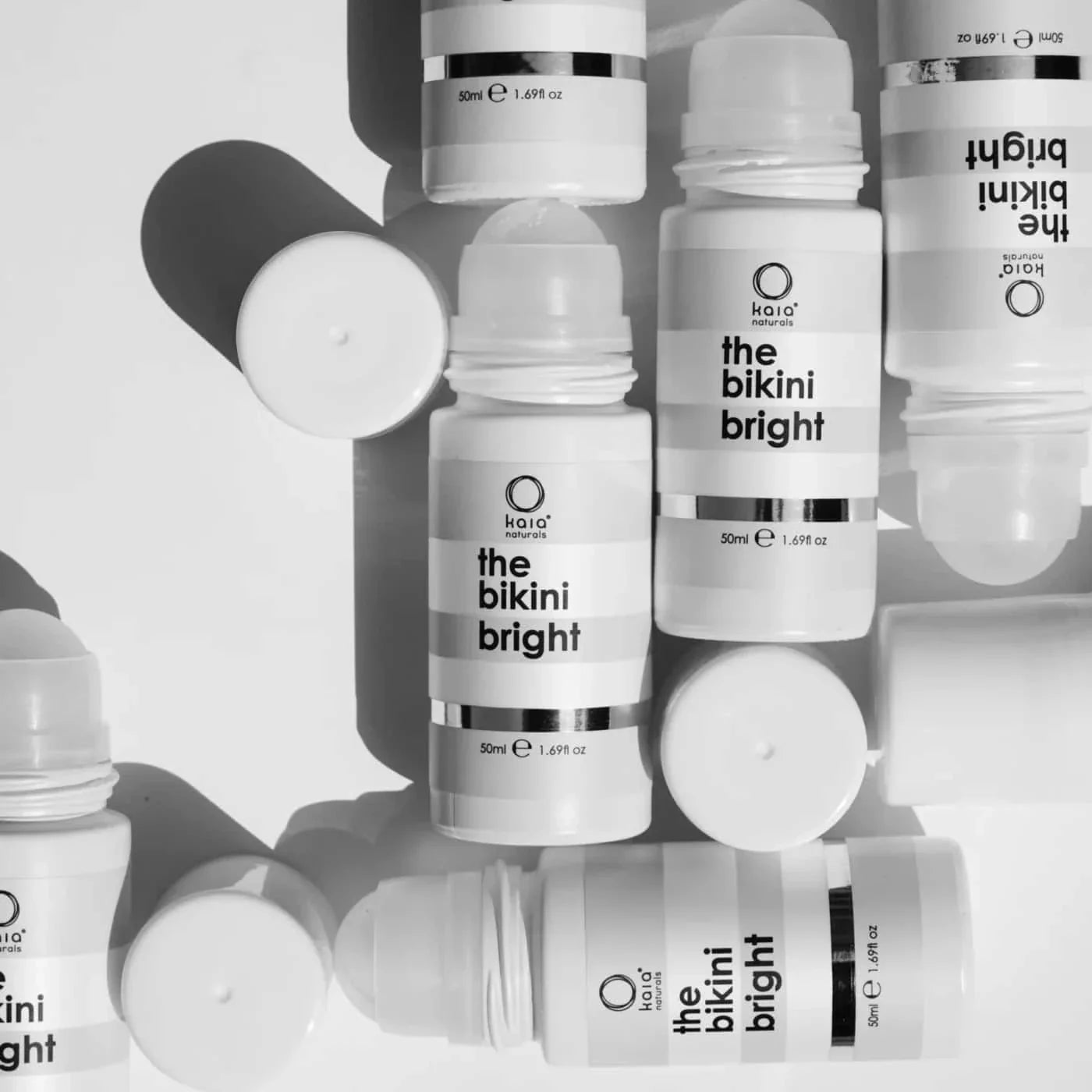 Many bottles of 'the bikini bright' with a white background