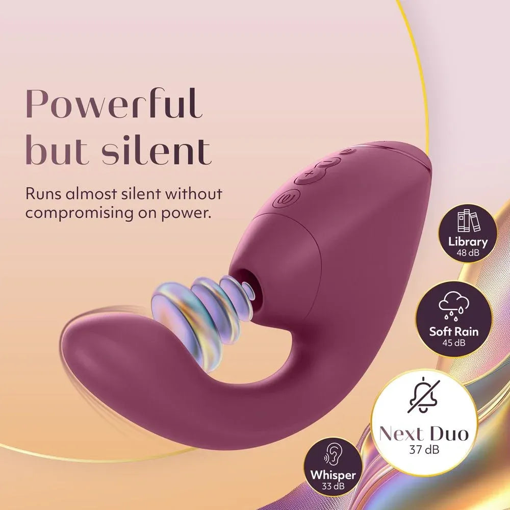 A purple curved personal massager shown on a soft peach and beige promotional background with marketing text reading 'Powerful but silent' and feature badges for library, soft rain, and whisper.