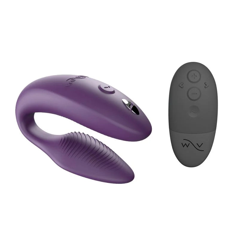 Purple and gray electronic device with remote control on a white background