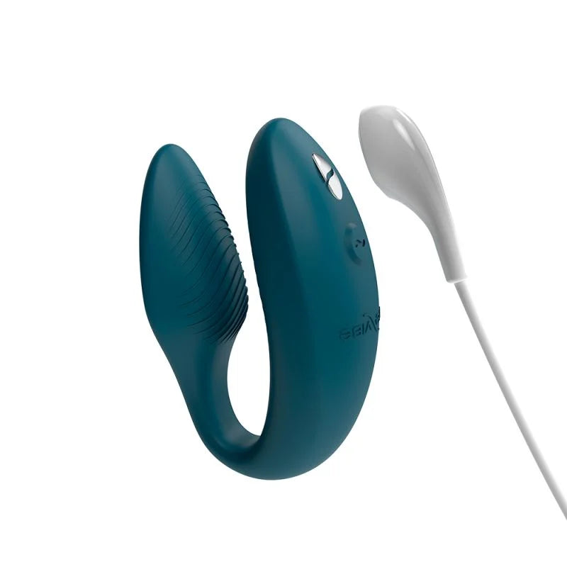 Blue electronic device with a white cable on a white background